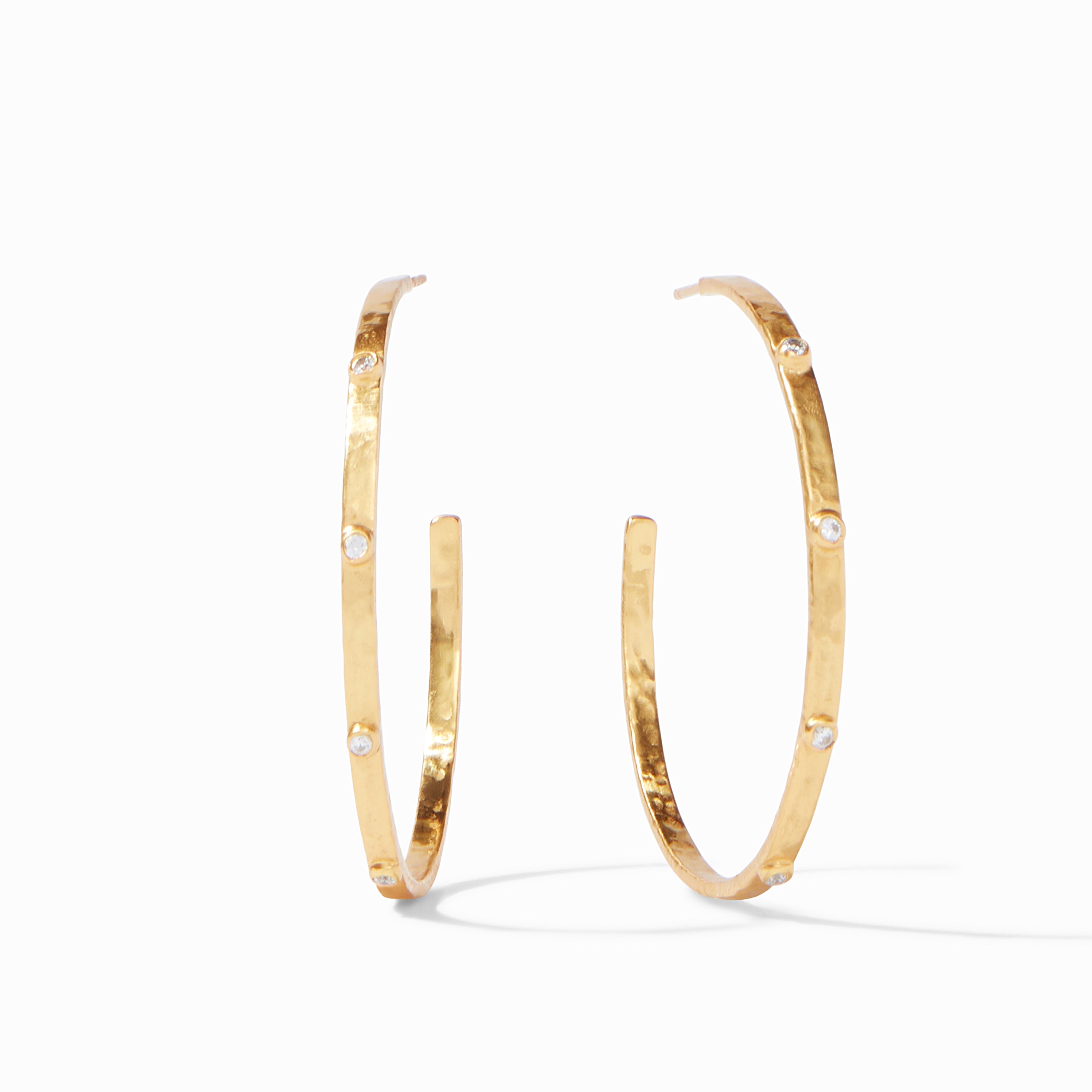 Gold hoop earrings on a white background