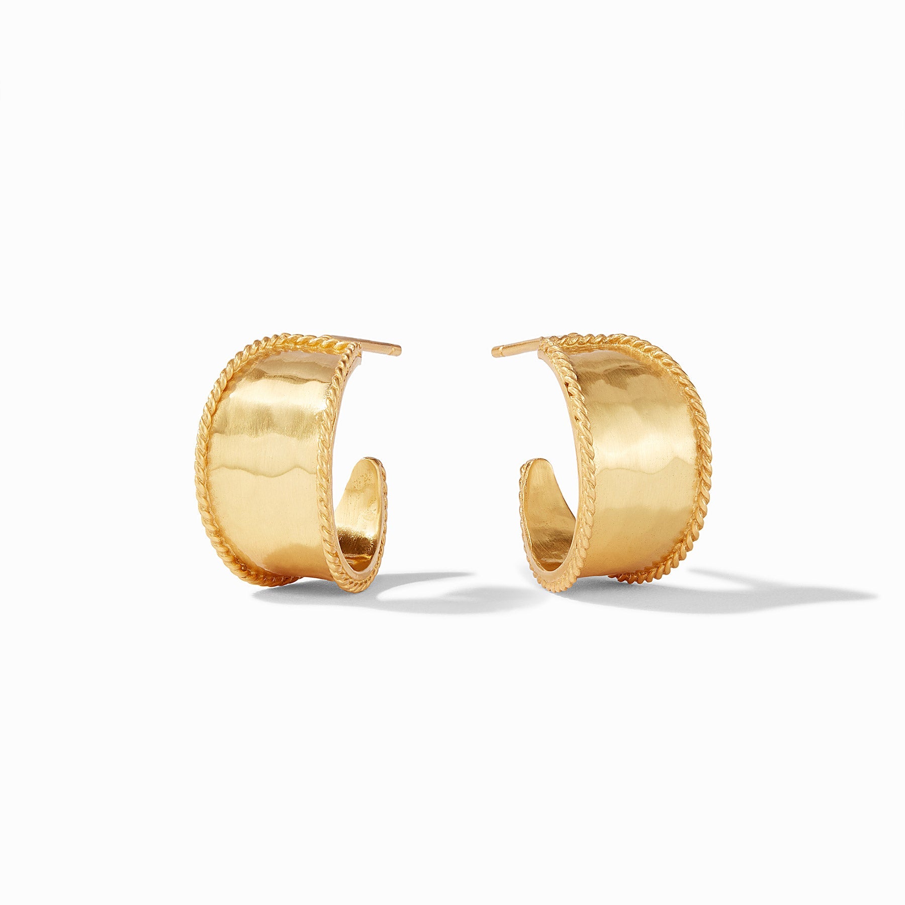 Pair of gold hoop earrings on a white background