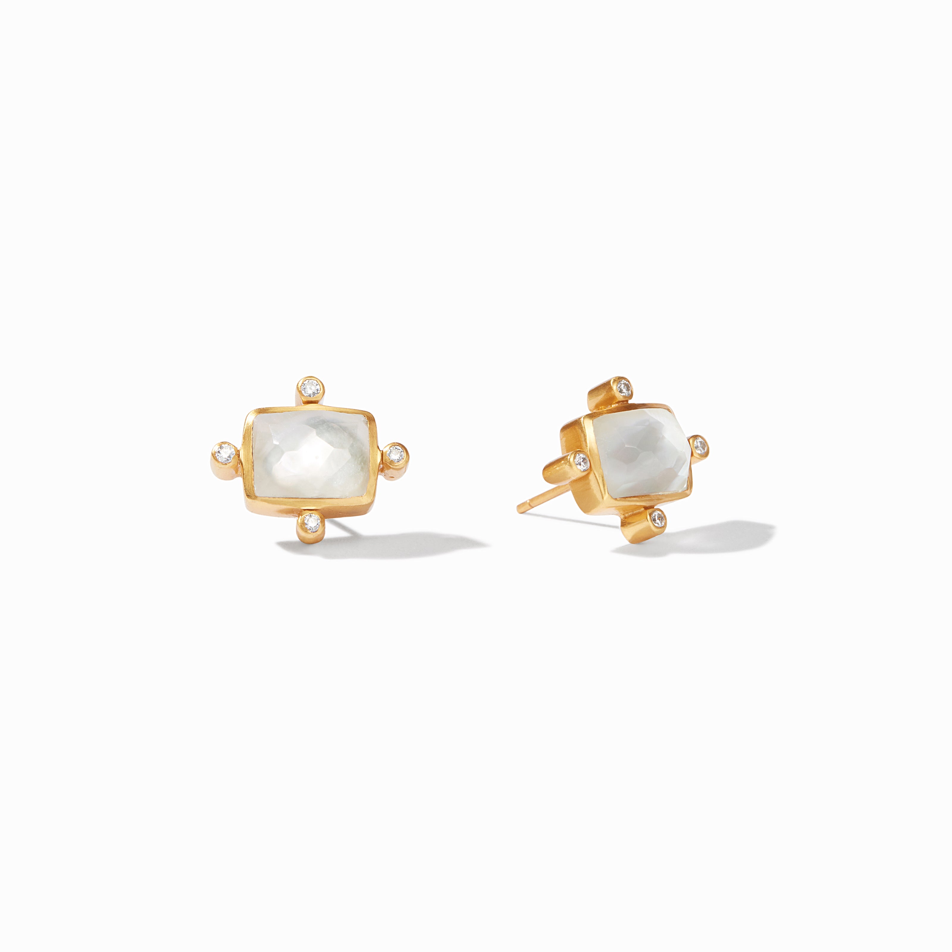 Gold earrings with square gemstones on a white background