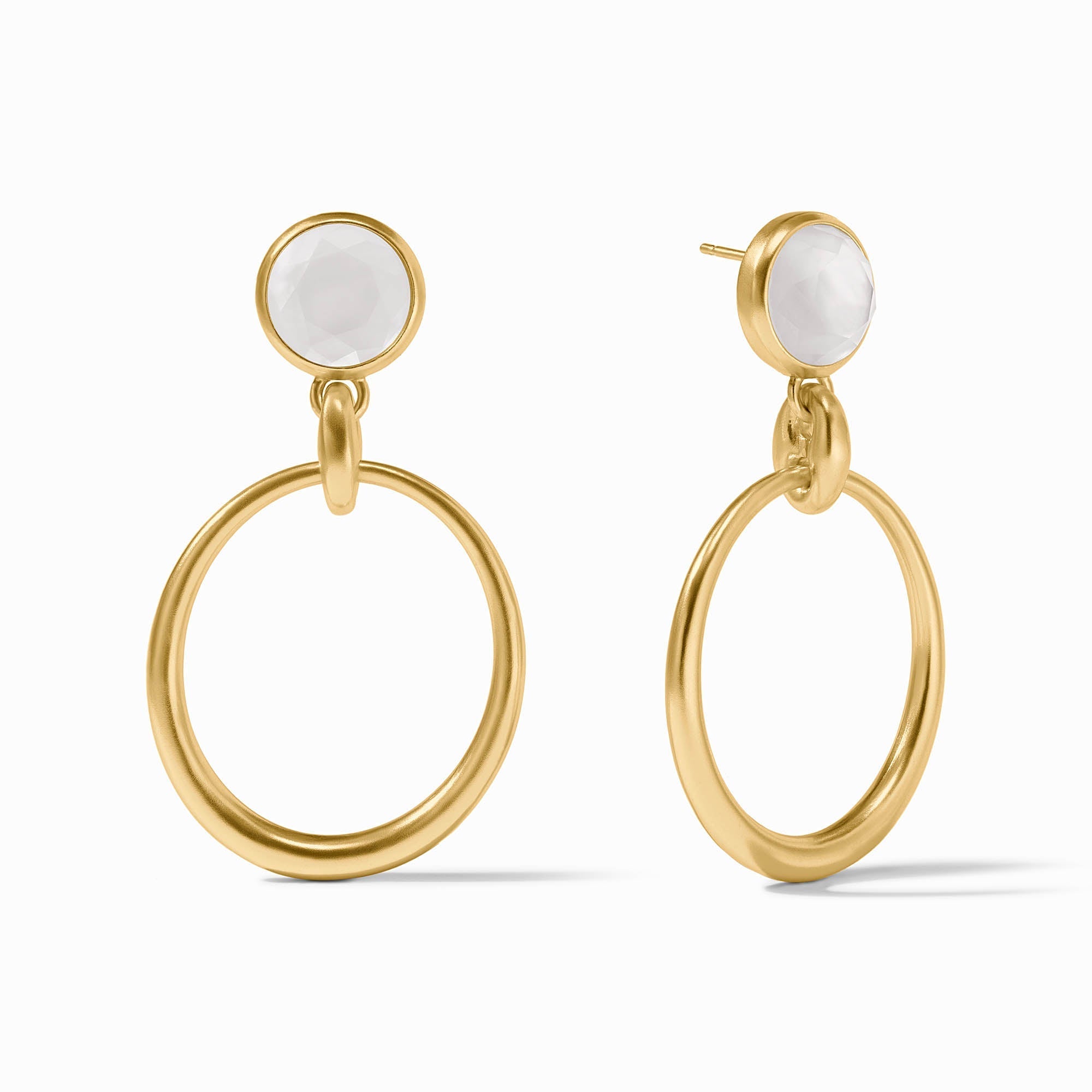 Gold hoop earrings with white stones on a white background
