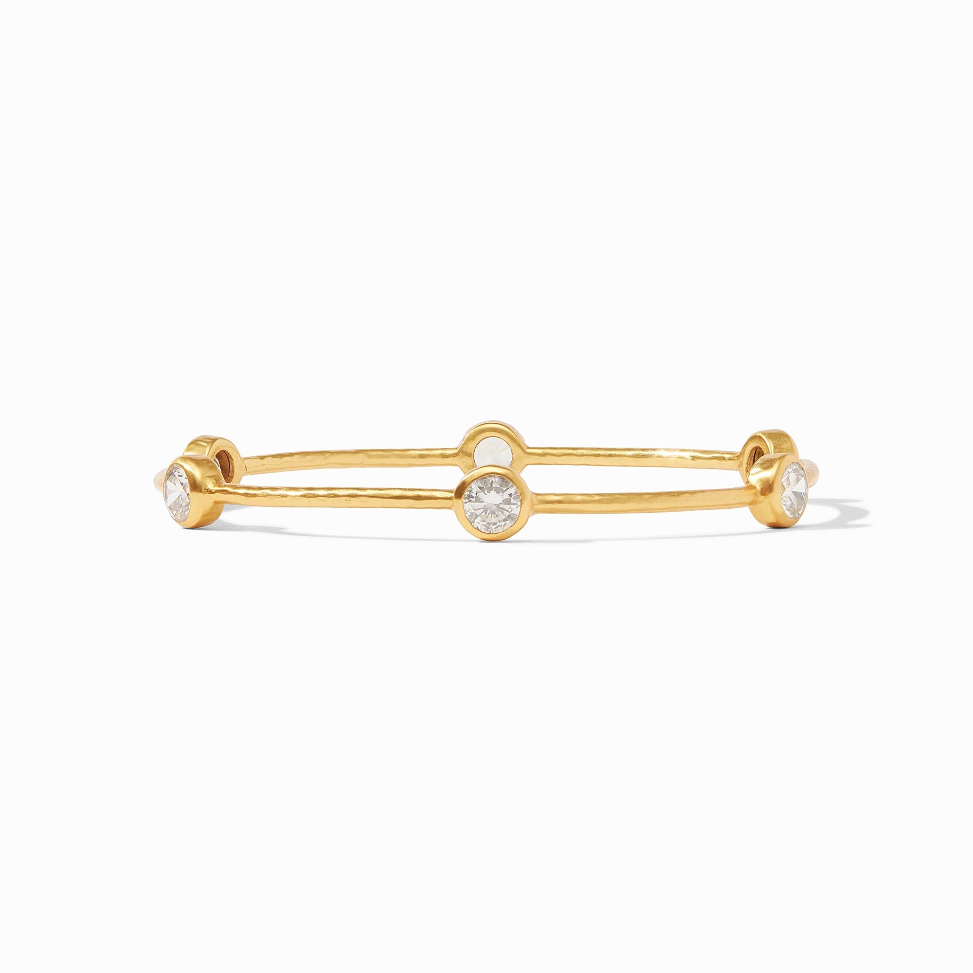 Gold bracelet with diamond accents on a white background