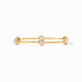 Gold bracelet with diamond accents on a white background