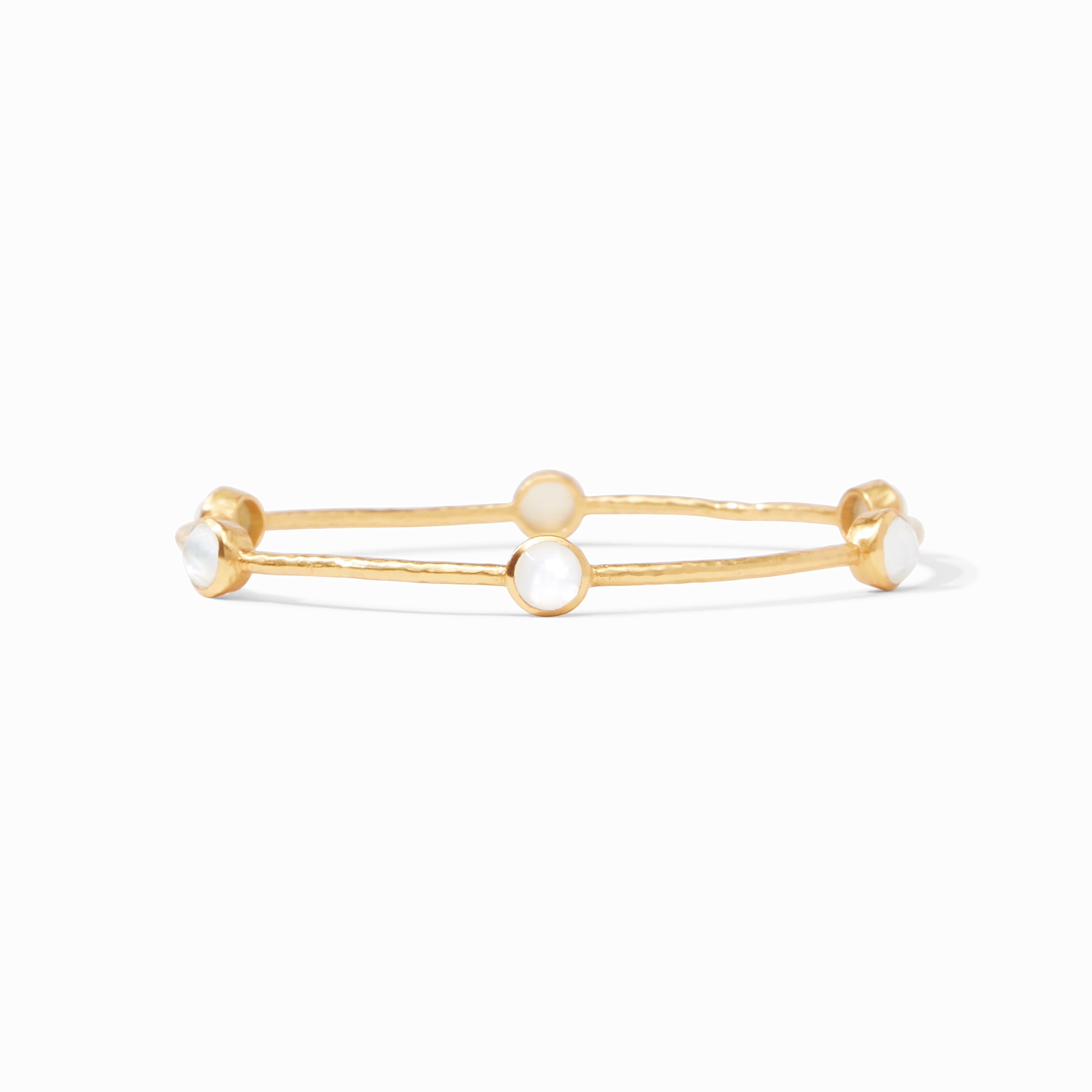 Gold bracelet with pearl-like beads on a white background