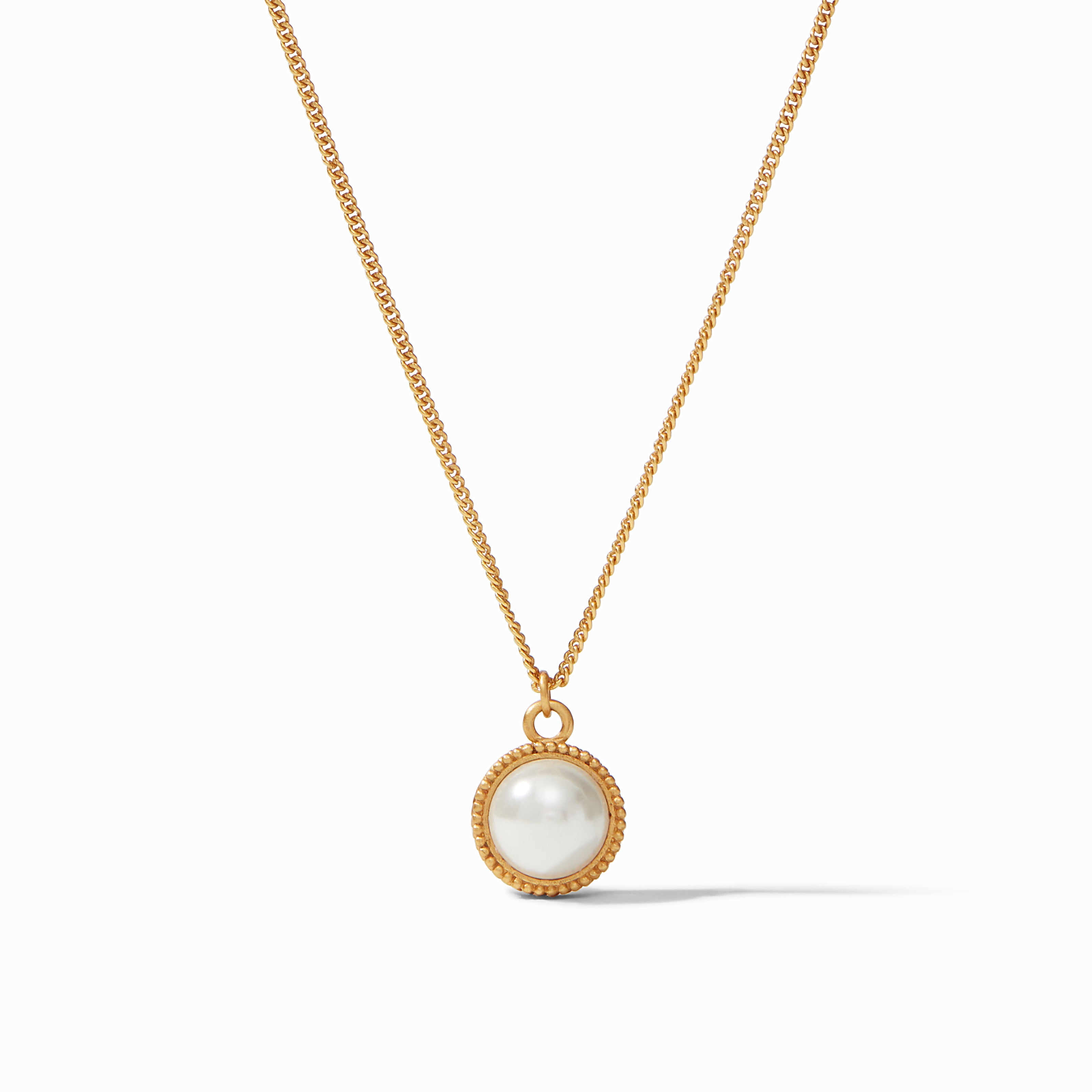 Gold necklace with a pearl pendant on a white background