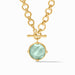 Gold necklace with a green pendant on a white background
