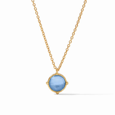 Gold necklace with a blue pendant on a white background
