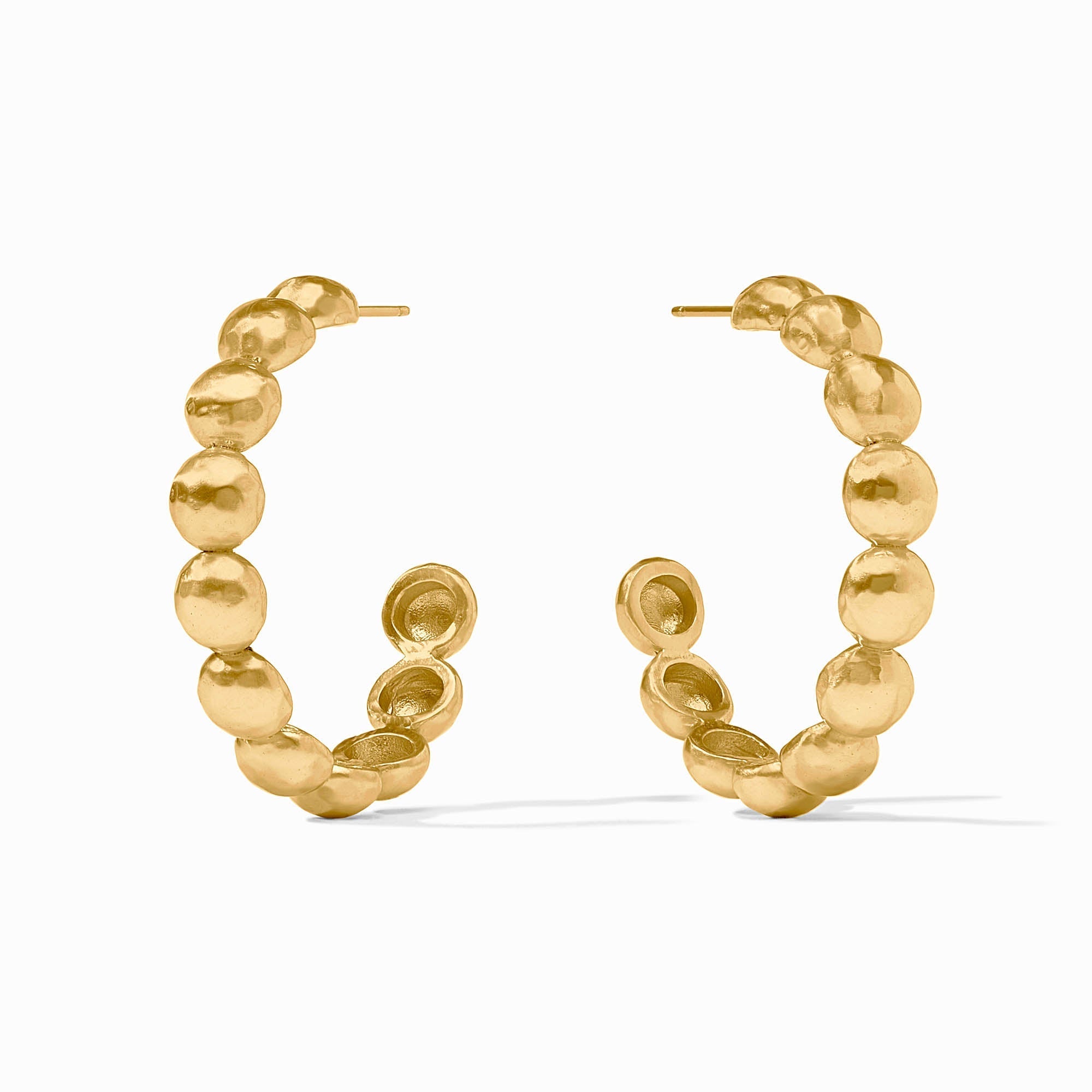 Gold hoop earrings with a textured design on a white background