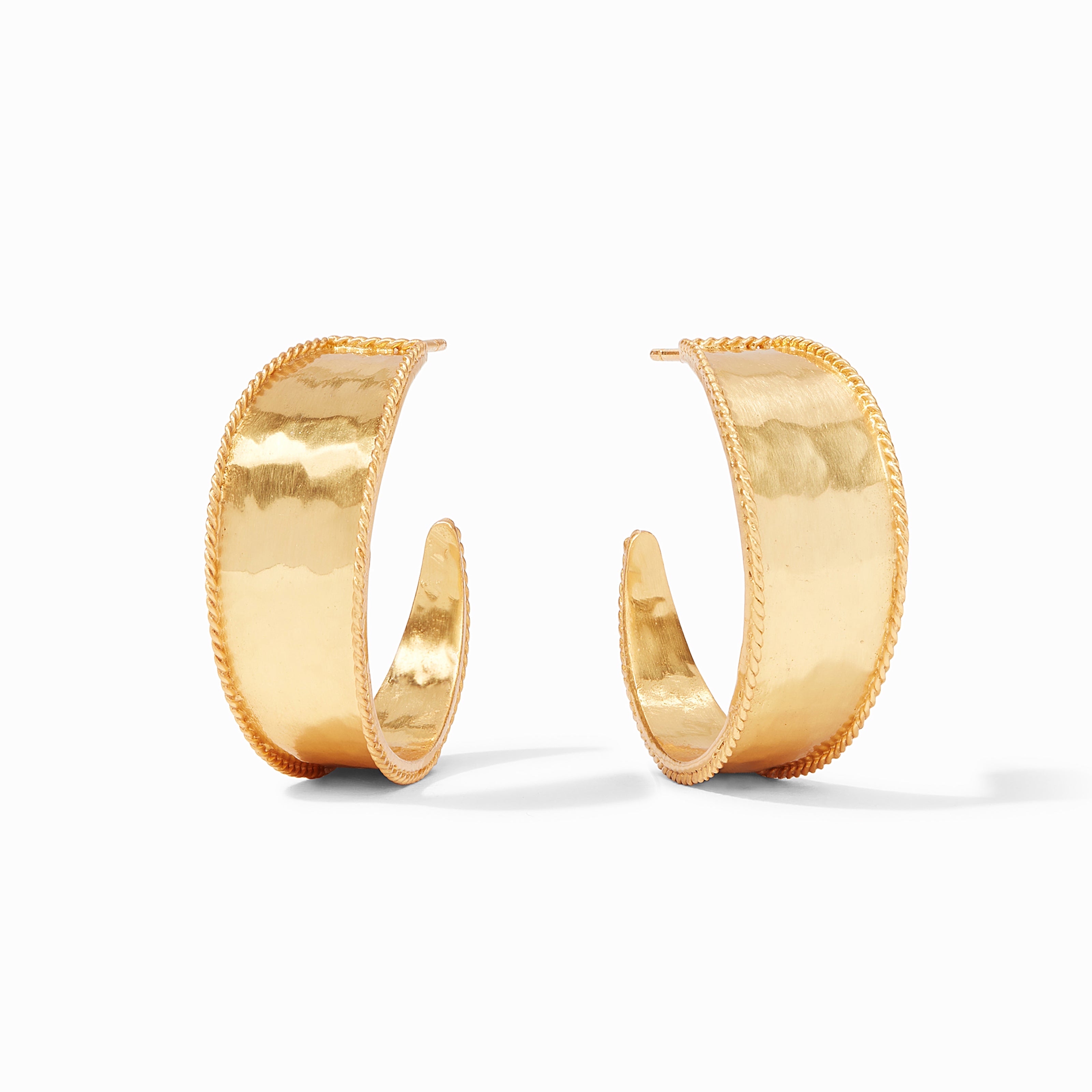 Gold hoop earrings on a white background