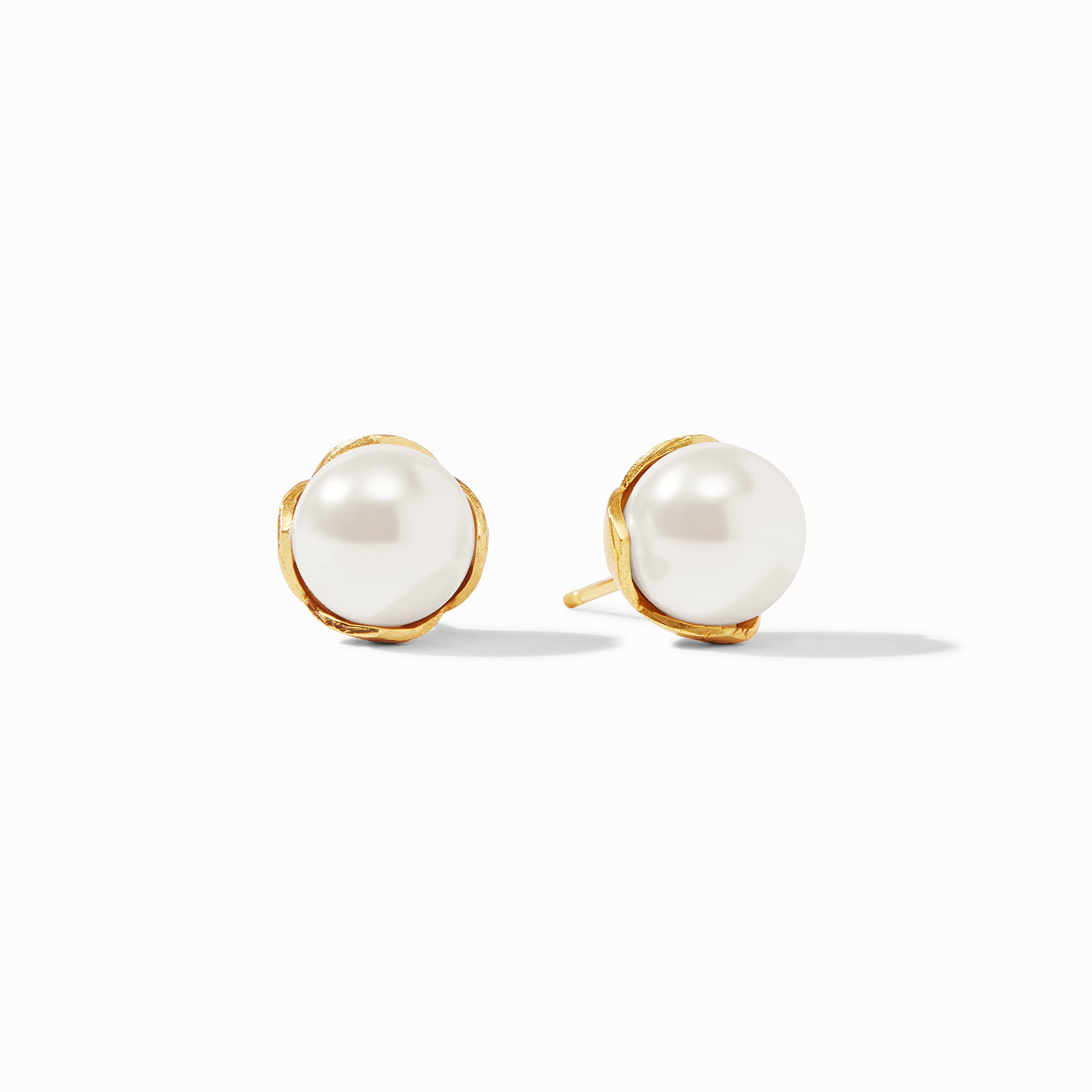 Pearl earrings with gold rims on a white background