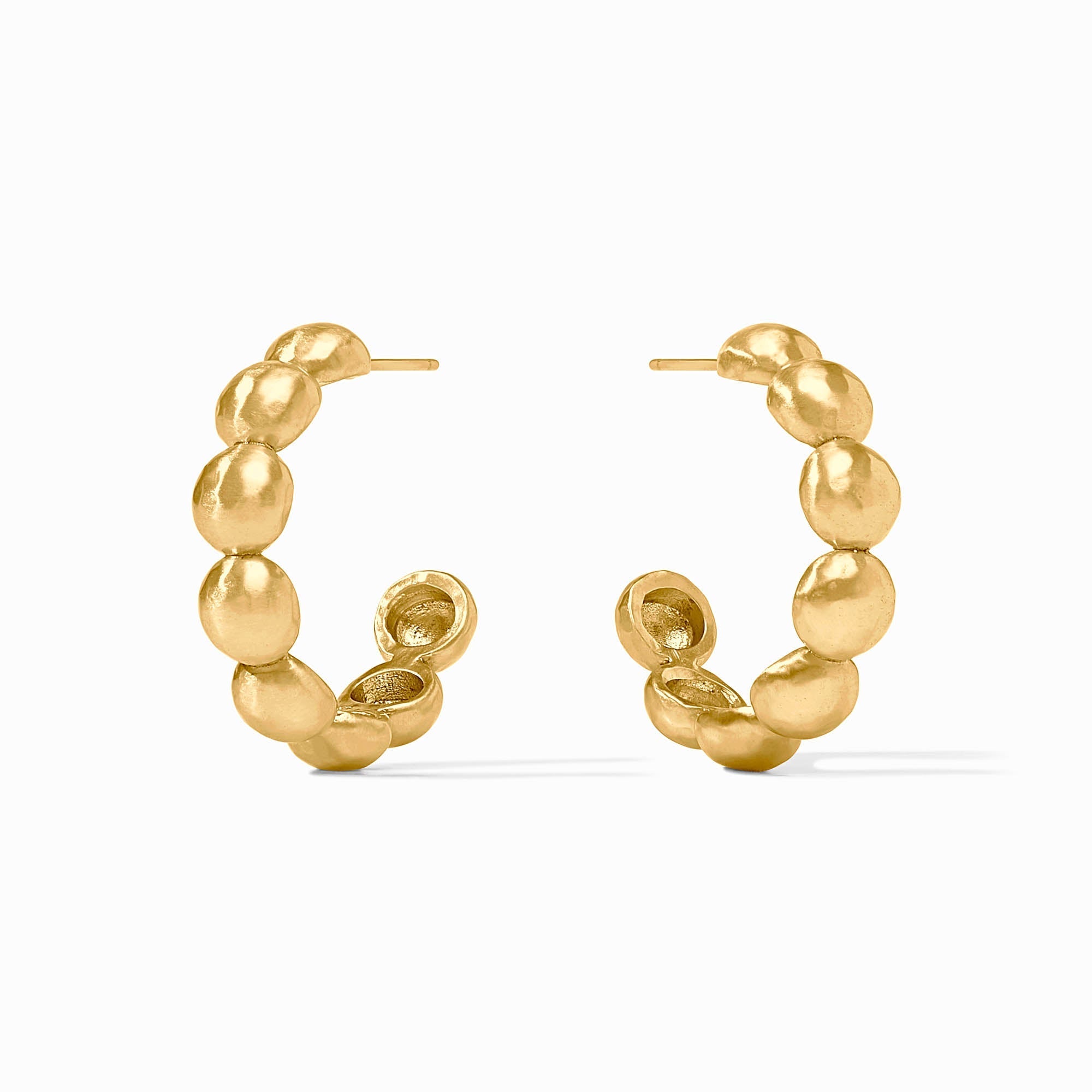 Gold hoop earrings with a textured design on a white background