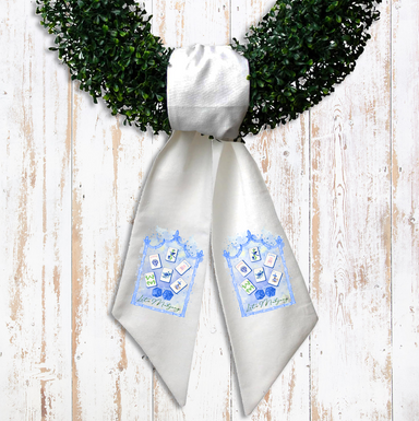 White ribbon with blue designs and text on a wooden surface