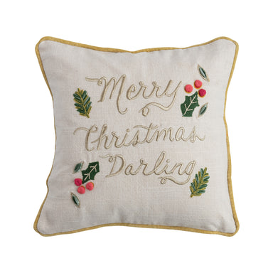 A square throw pillow with 'Merry Christmas Darling' embroidered on it, surrounded by holly and berries, with a beige background and a yellow border.