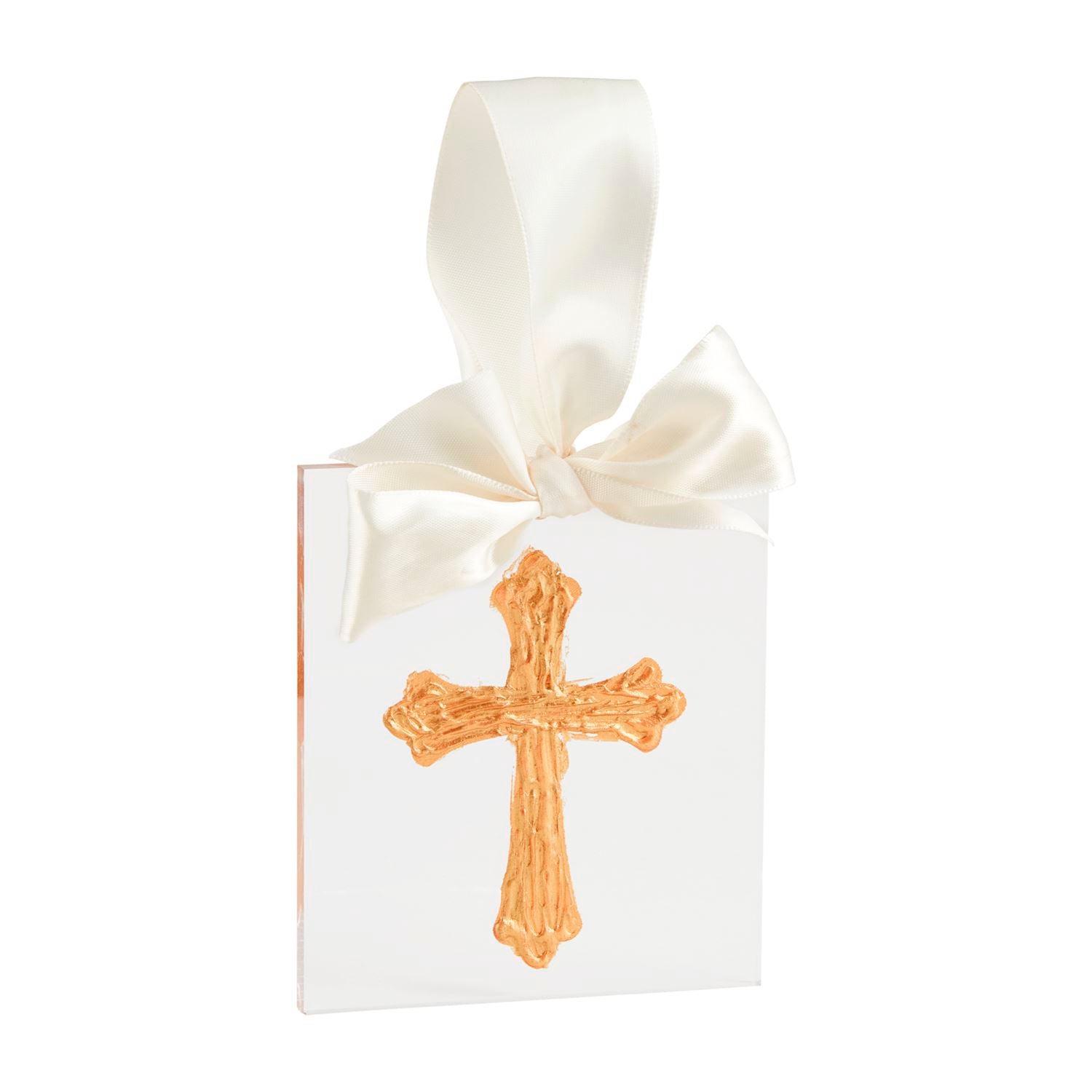 A gold acrylic ornament in the shape of a cross, attached to a white ribbon that is looped and tied in a bow at the top.