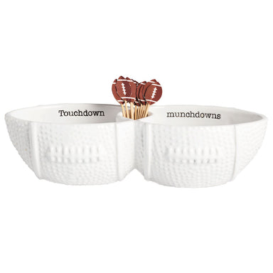 A white ceramic football-shaped toothpick server set with two bowls and a set of toothpicks decorated with a football design.