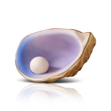 Pearl inside an open oyster shell on a white background
