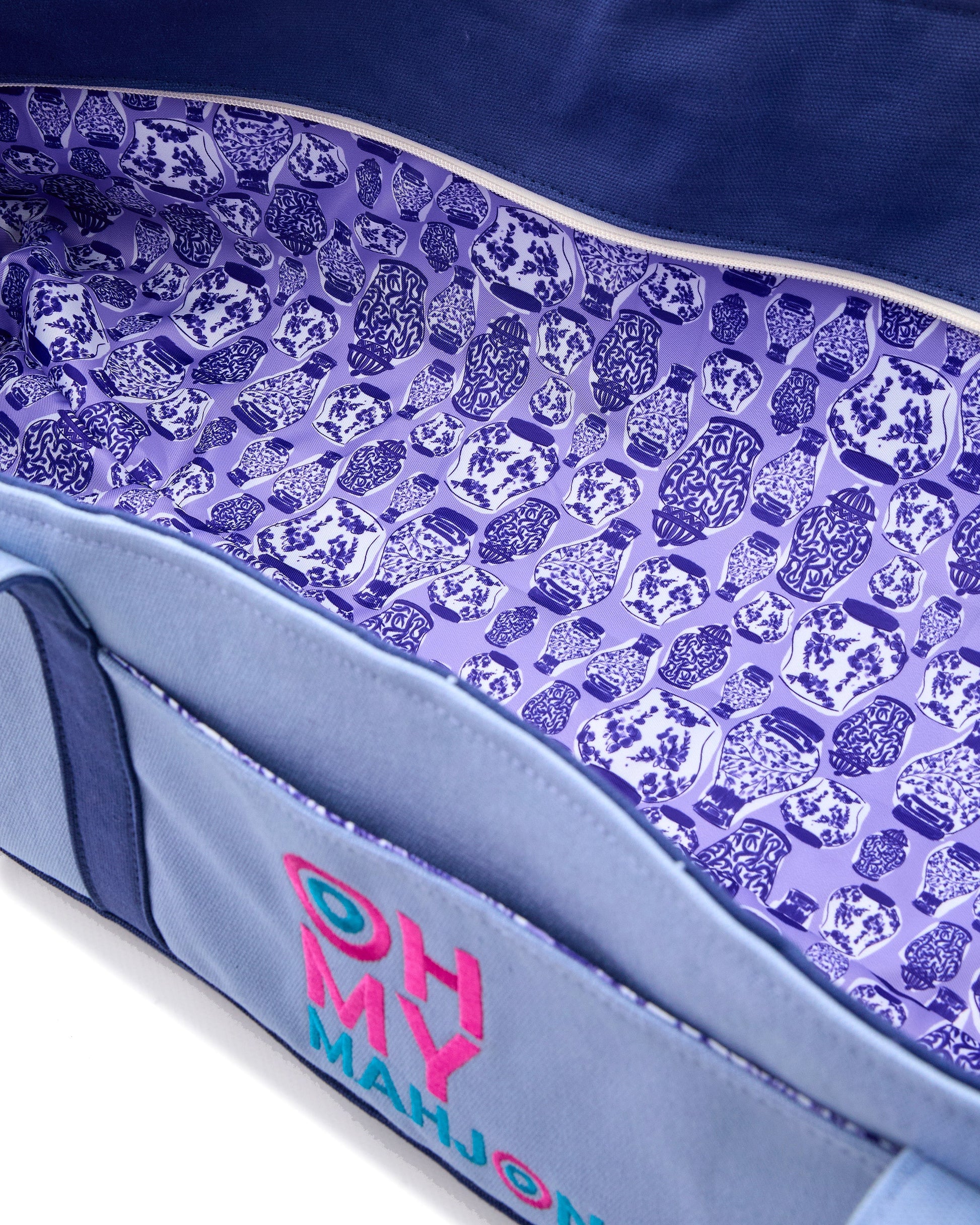 Close-up of a purple and blue board game box with 'Oh My Mahjong' text.