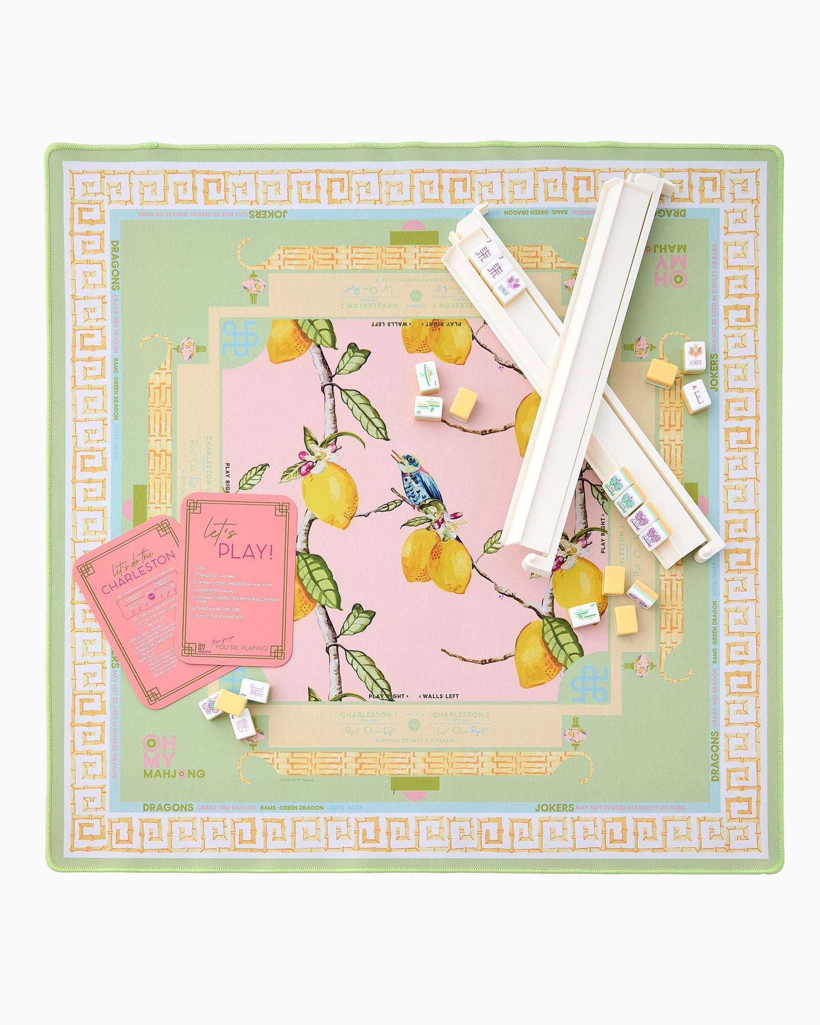 Board game set with lemon-themed design on a green border
