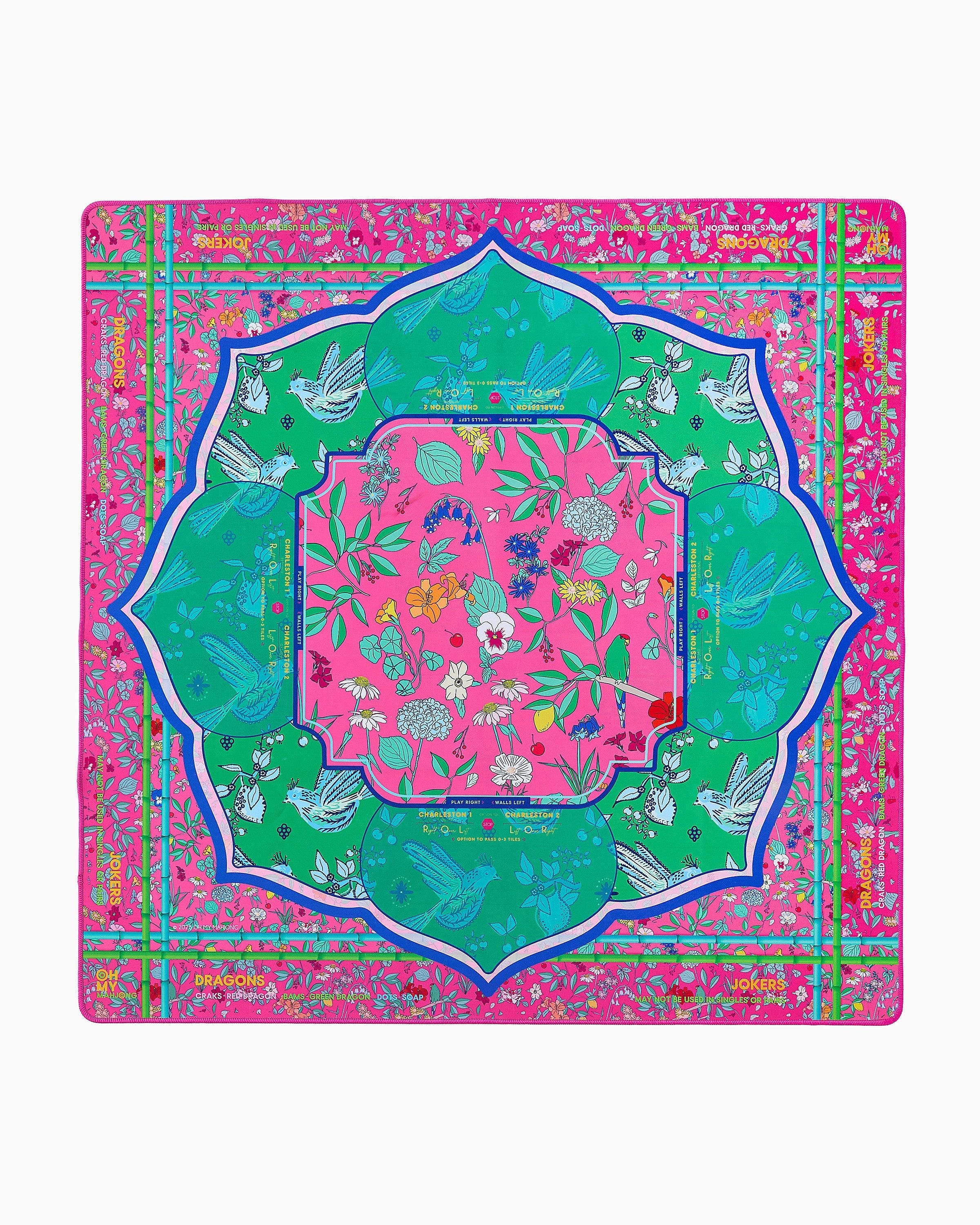 Colorful decorative mat with floral and bird patterns on a pink background