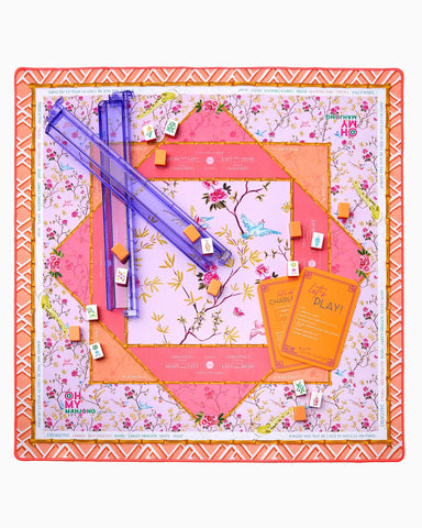 Floral-themed board game set with colorful components on a decorative board.