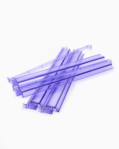 Purple plastic straws on a white background