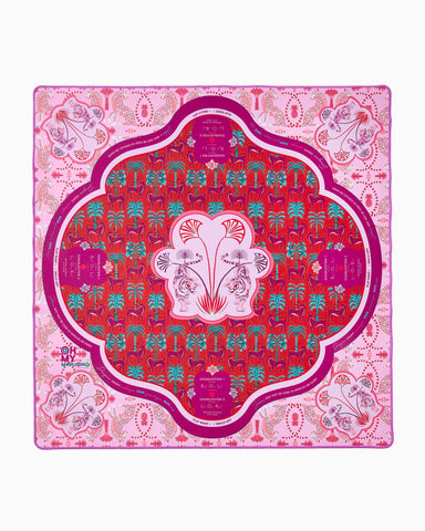 Decorative pink and red patterned mat with central design on a white background