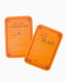 Two orange playing cards with text on a white background