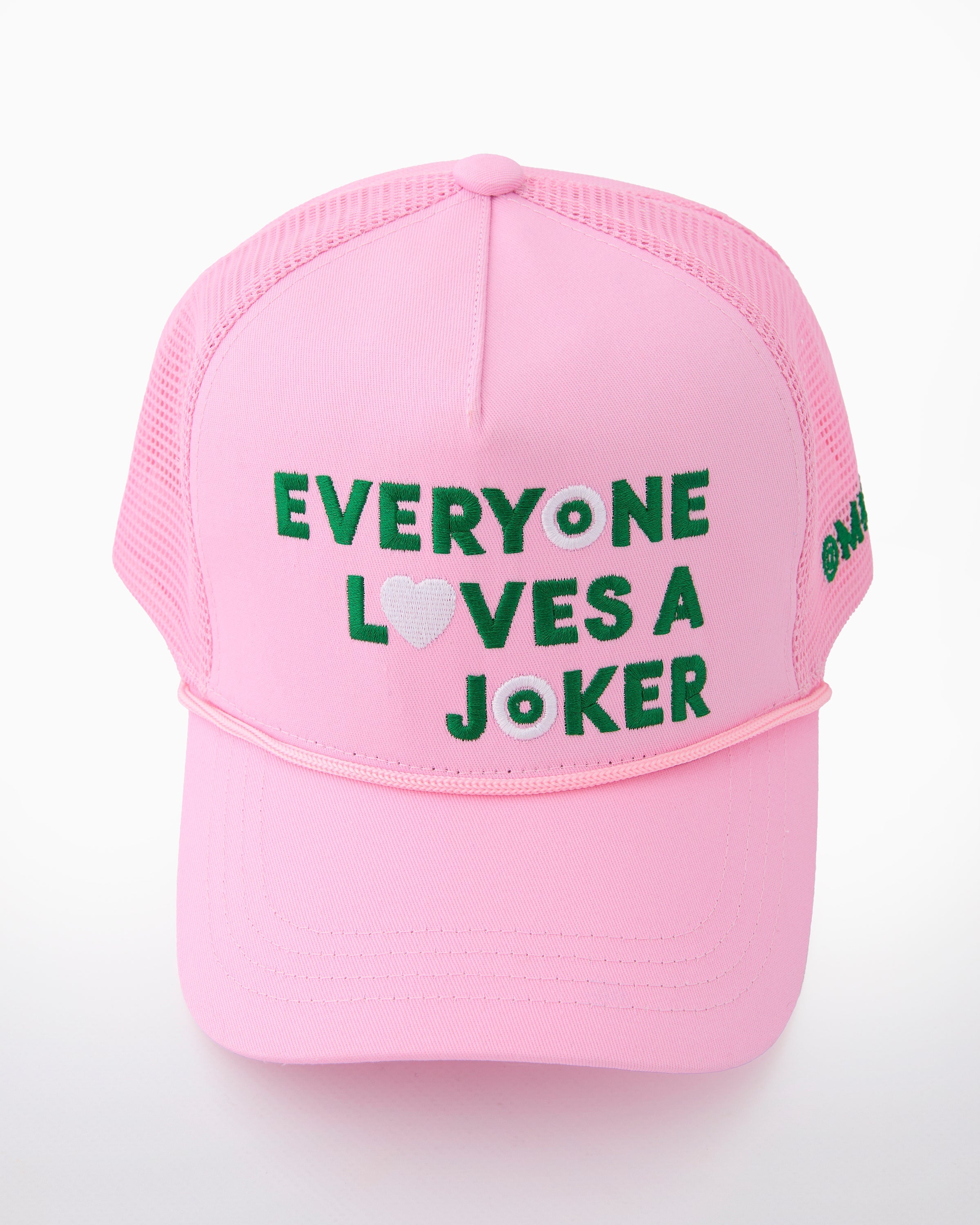 Pink cap with text 'Everyone loves a joker' on a white background