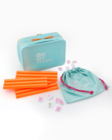 Teal box with orange straws and pink bags on a white background
