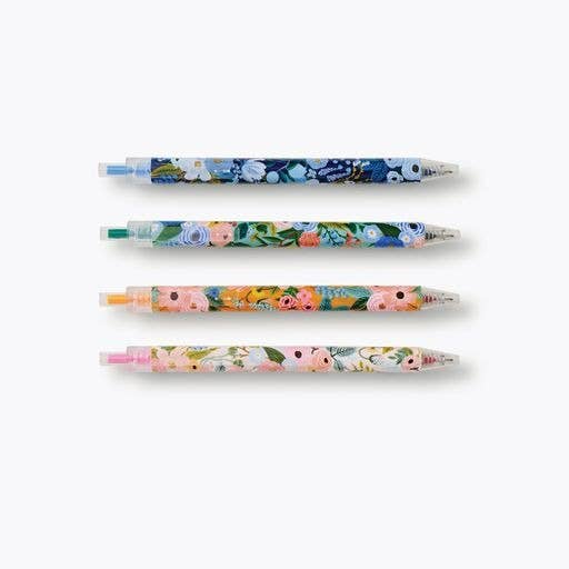 Set of four floral-patterned pens on a white background