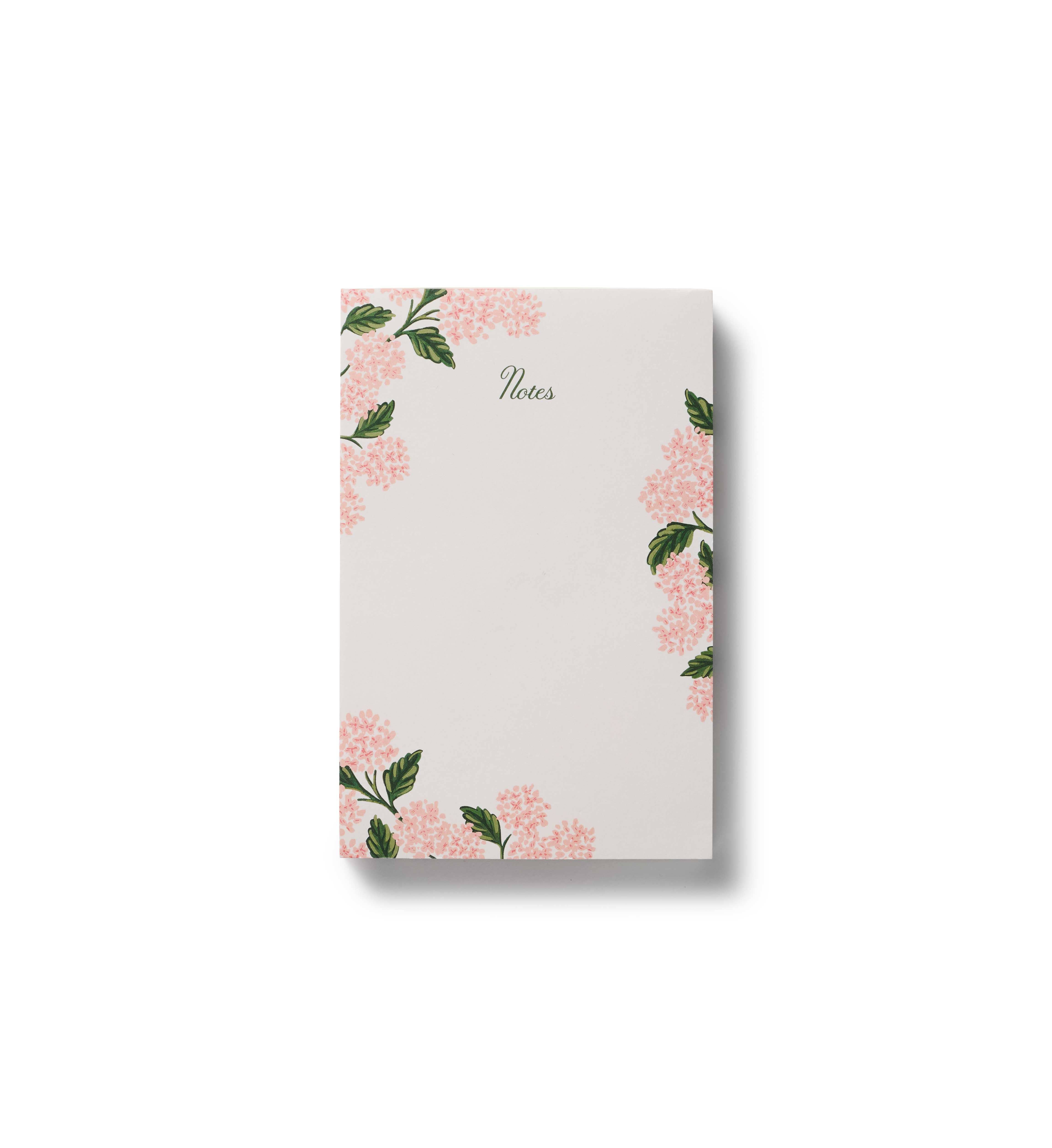Notebook with floral design on a white background