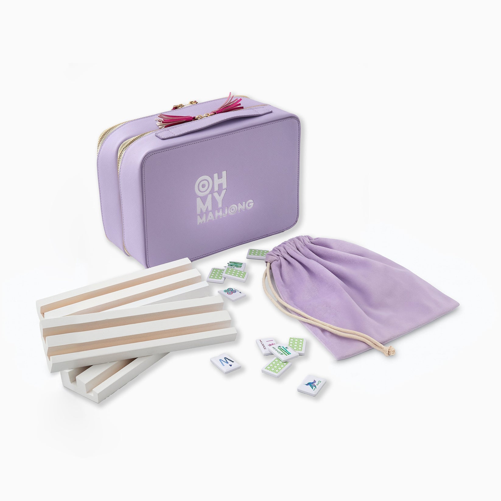 Purple travel case with mini dominoes set and accessories on a white background