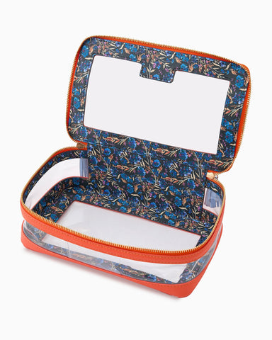 Floral-patterned makeup case with orange trim on a white background