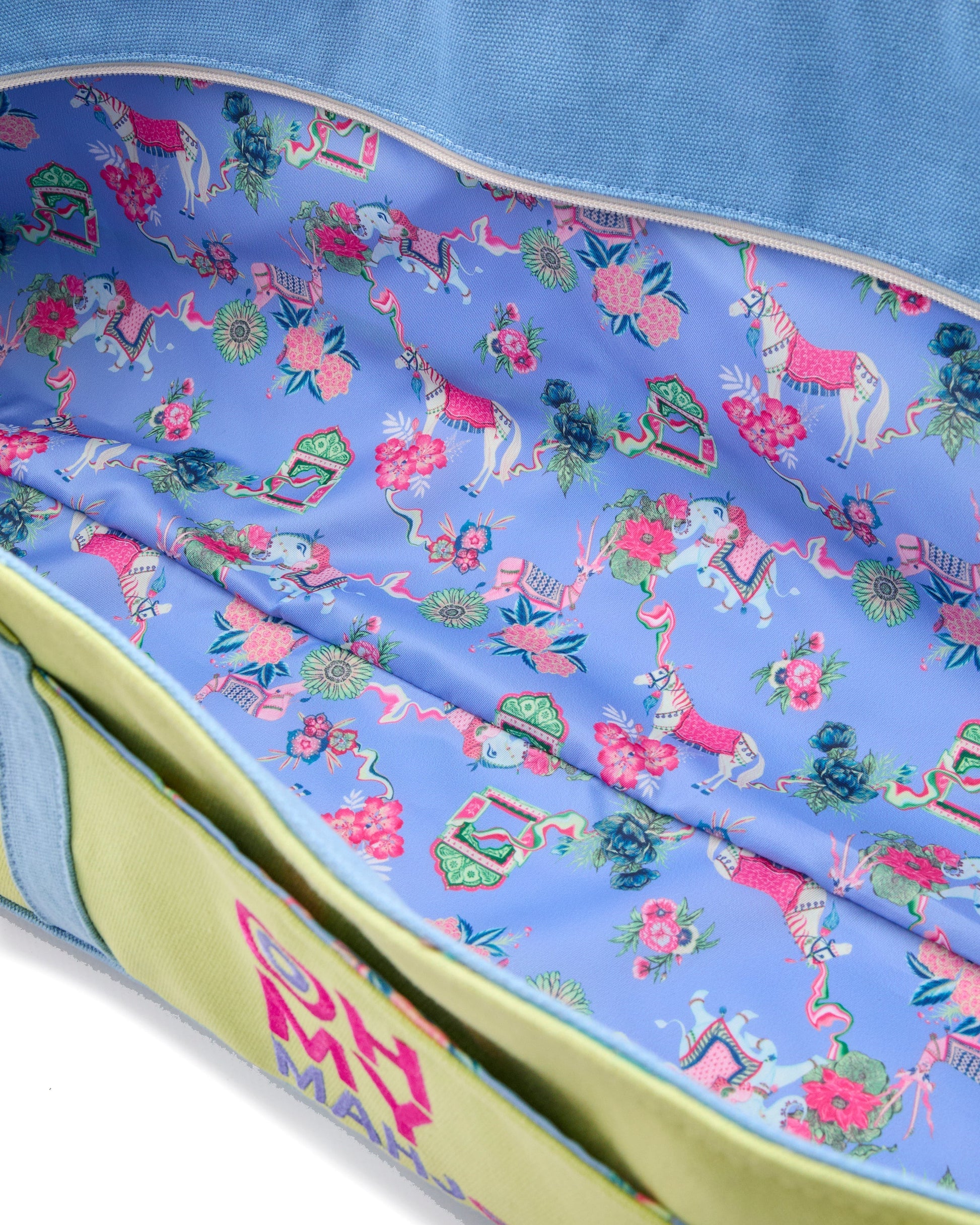 Colorful fabric with floral and horse pattern on a blue background