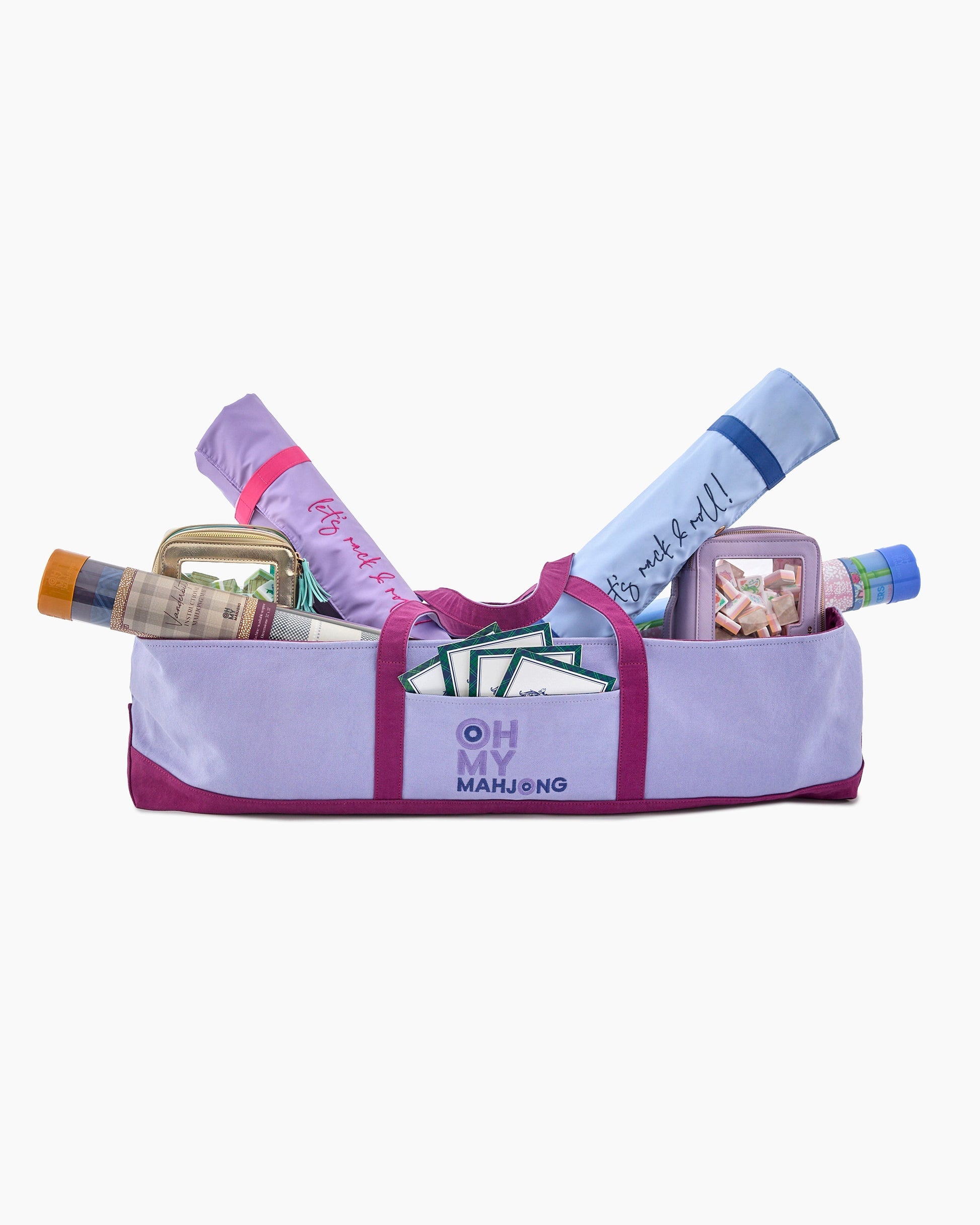 Purple mahjong bag with mahjong tiles and accessories on a white background