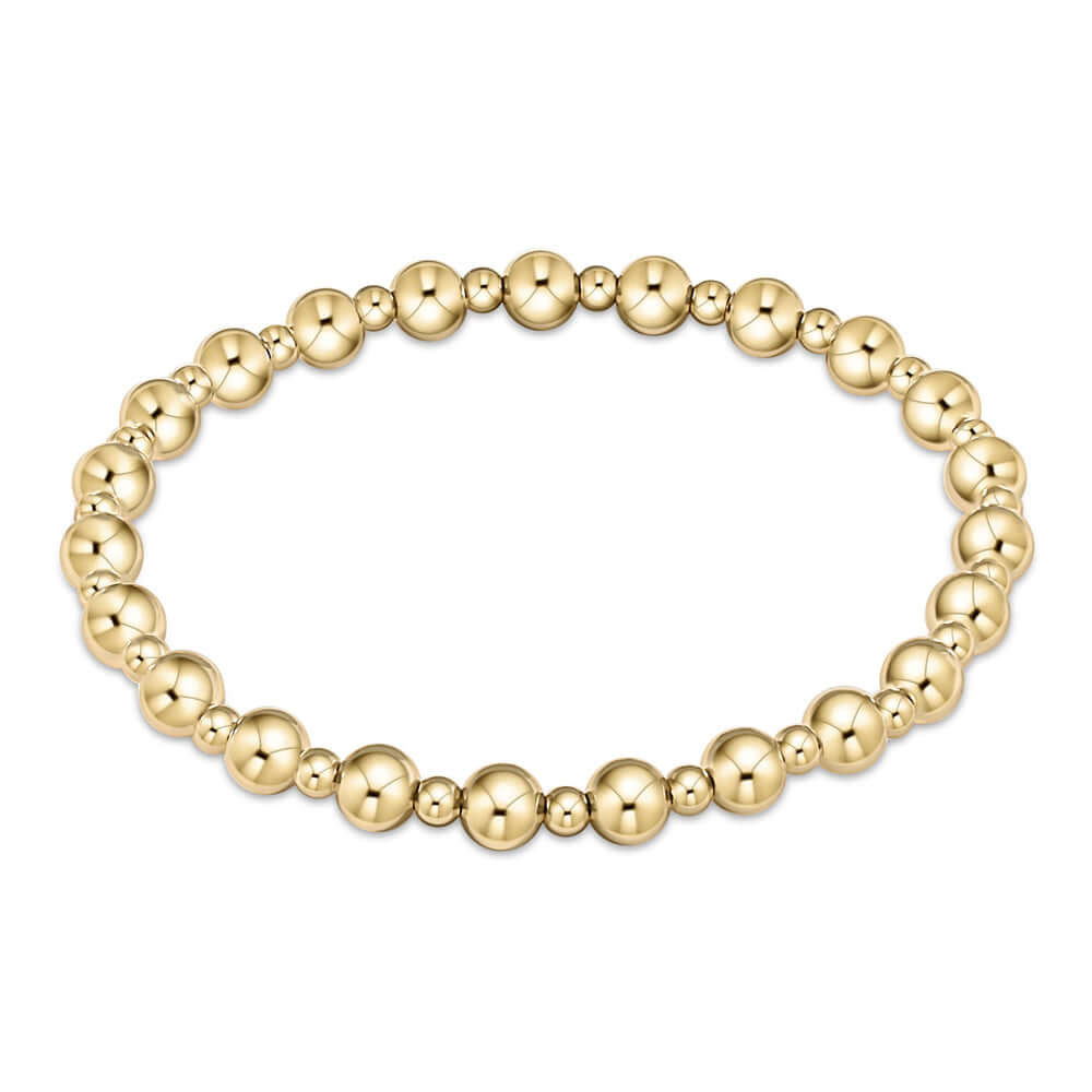 A gold-filled bracelet with alternating bead sizes, hand beaded on elastic.