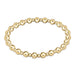 A gold-filled bracelet with alternating bead sizes, hand beaded on elastic.
